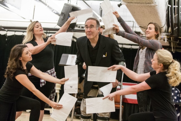 Lawrence Redmond (Grahame Chandler) and the ladies of The Fix rehearse a big production number. 